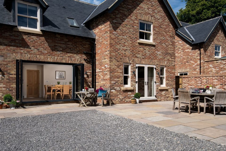Partridge Lodge - the extensive terrace area; perfect for alfresco dining with a BBQ also provided