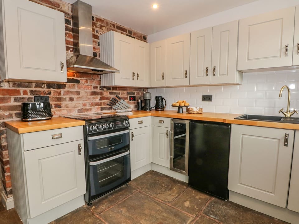 Fridge, dishwasher, electric kettle, cookware/dishes/utensils