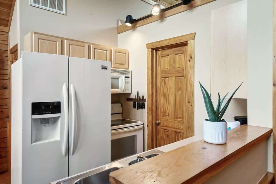 Modern appliances & warm wood accents await your culinary adventures!