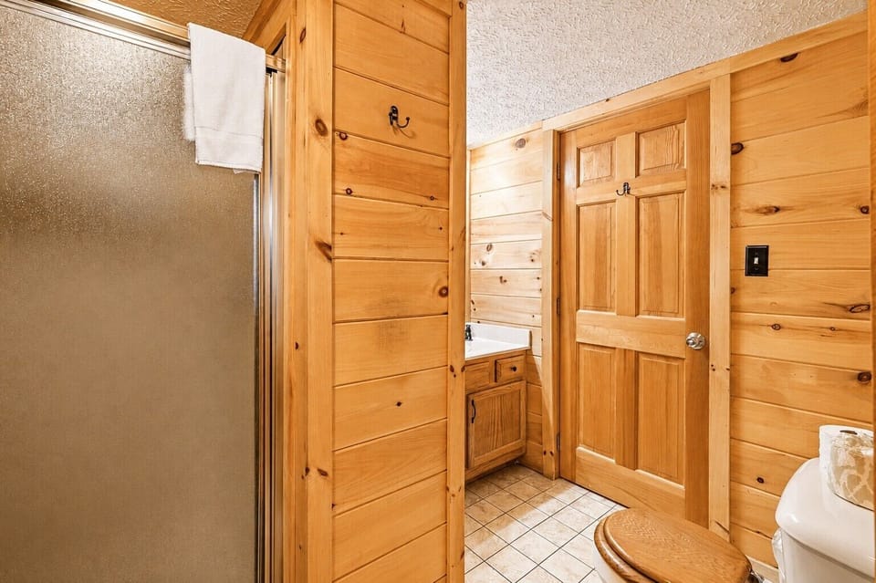 Full bathroom downstairs with walk in shower.