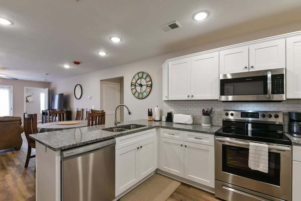 Well quipped kitchen with specialty items like an air fryer, blender, and a crock pot!