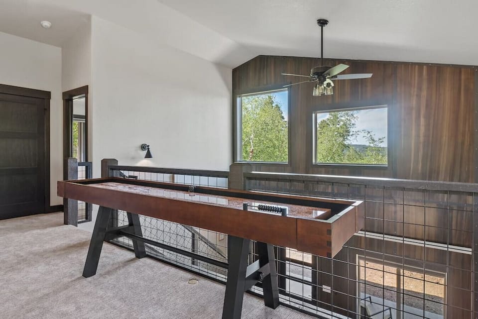 Unwind and have a blast in our spacious game room featuring a classic shuffleboard table!