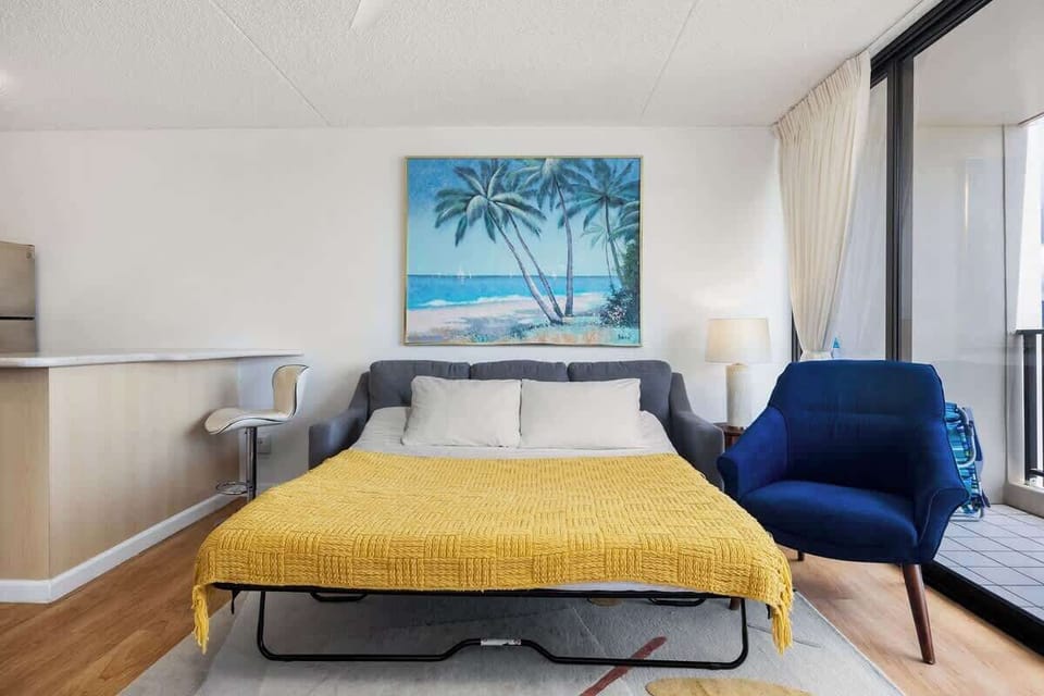 Transform the living area into a cozy sleeping space with a pull-out sleeper sofa, perfect for additional guests.