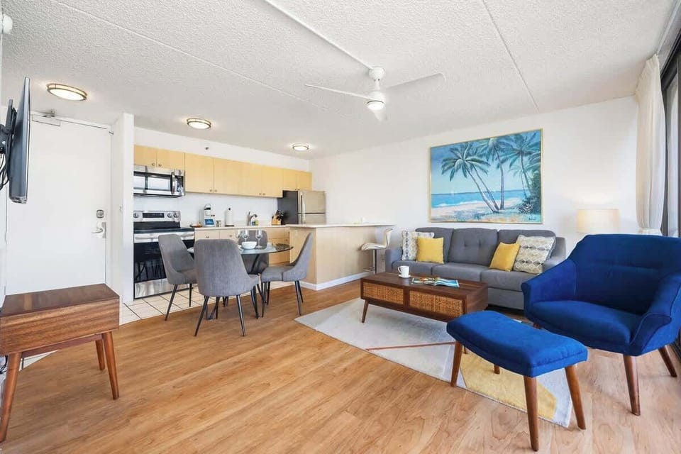 Relax and unwind in the open-concept living area that seamlessly connects the kitchen, dining, and living spaces.