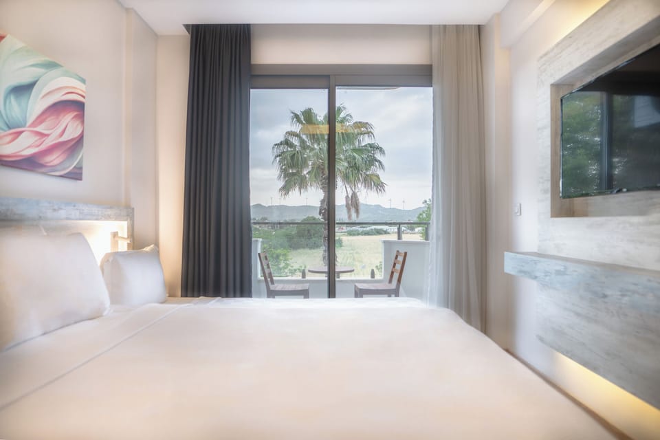 Standard Triple Room | Minibar, in-room safe, laptop workspace, soundproofing