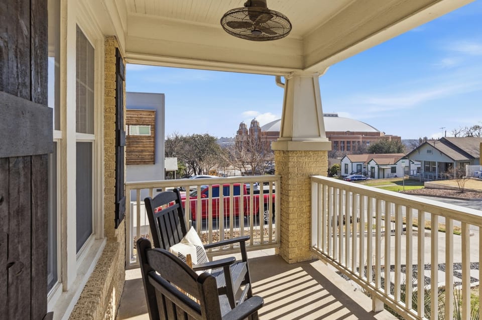 This inviting front porch overlooks Dickies Arena, putting you right near the excitement. Even with its proximity to the venue, the atmosphere stays calm and quiet for your relaxation.