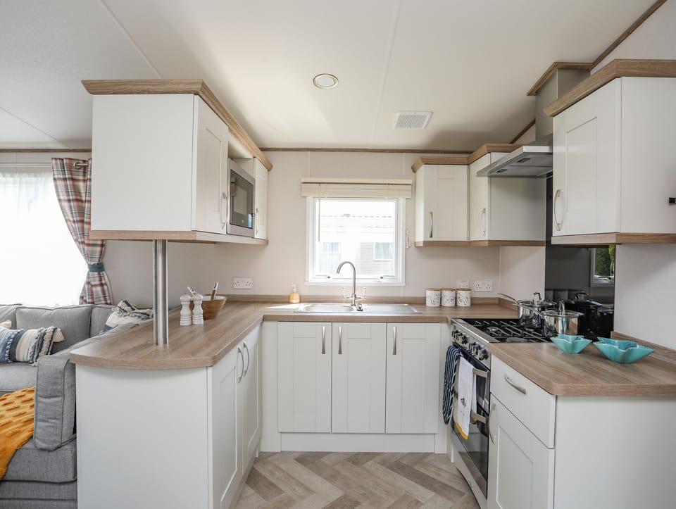 Fridge, electric kettle, cookware/dishes/utensils