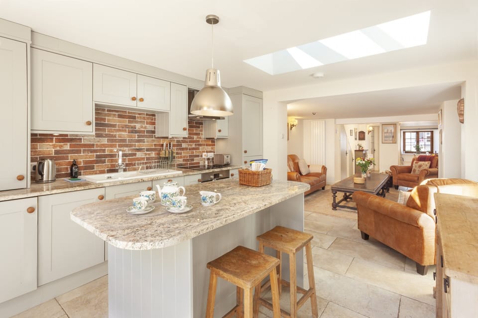 Kitchen breakfast bar area, looking out into the garden