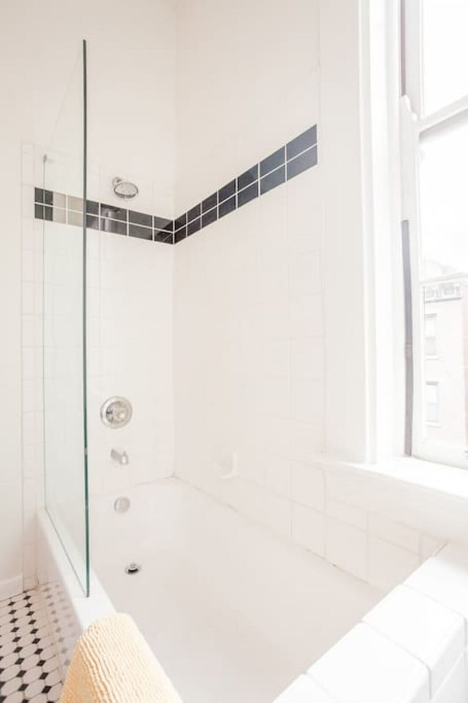 Bathtub and shower connected to King bedroom
