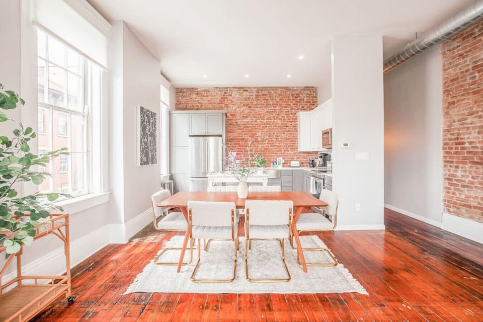 Open living room, dining room, and kitchen area.  Dining comfortably seats 6.