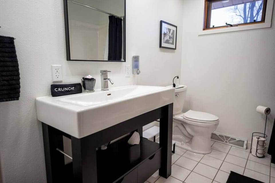 Upstairs bathroom with vanity sink.