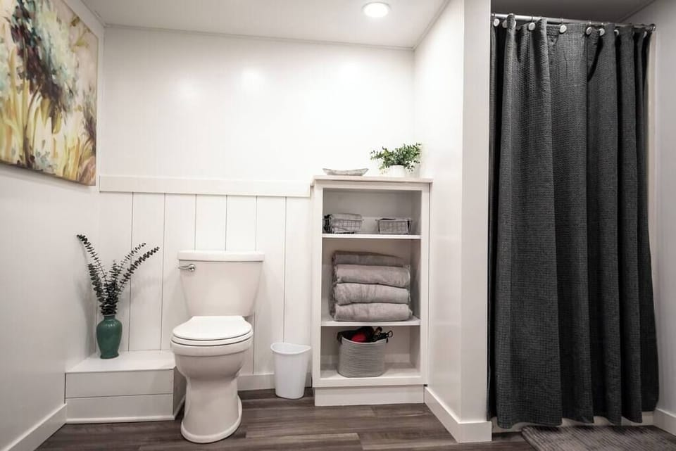 Basement bathroom with full shower.