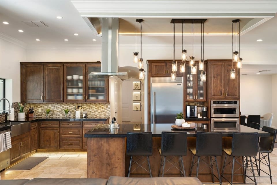 Cook and dine in style! Our modern kitchen features sleek designs, a spacious dining area, and elegant ceiling lights, perfect for culinary adventures and memorable meals. Your gourmet getaway awaits!