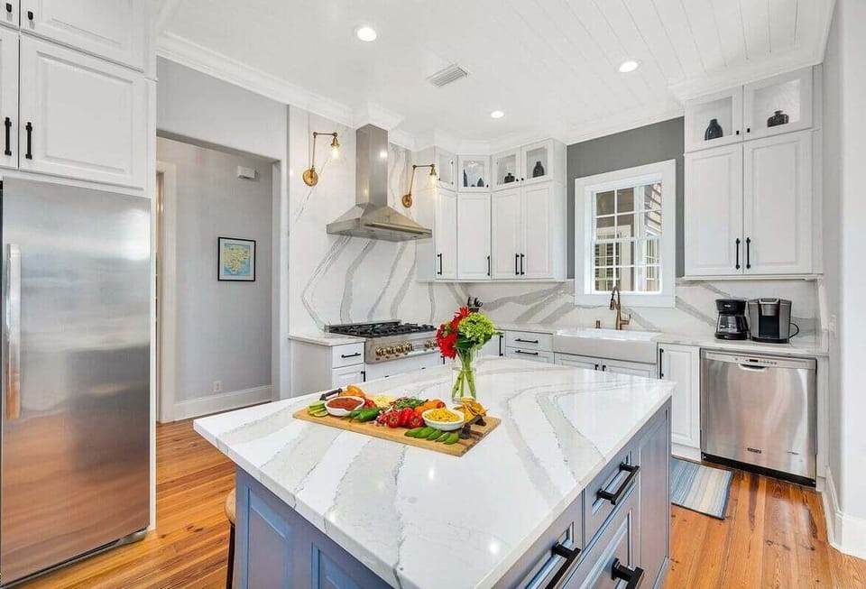 Close-up of kitchen island with view of stainless steel appliances