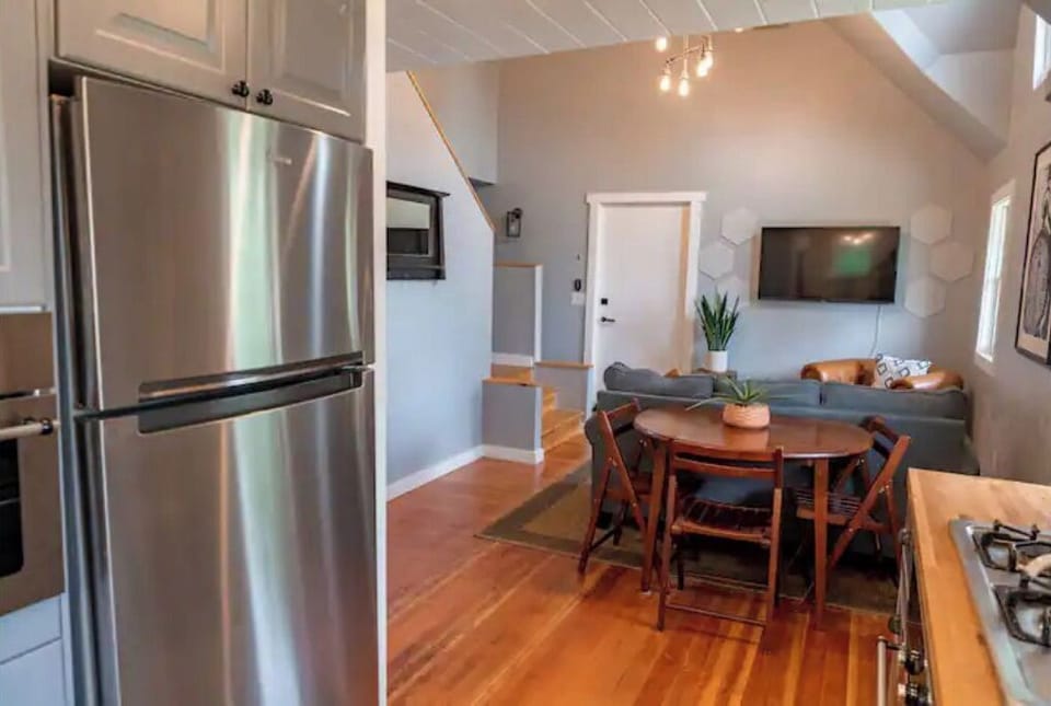 Looking from kitchen to dining table and living room