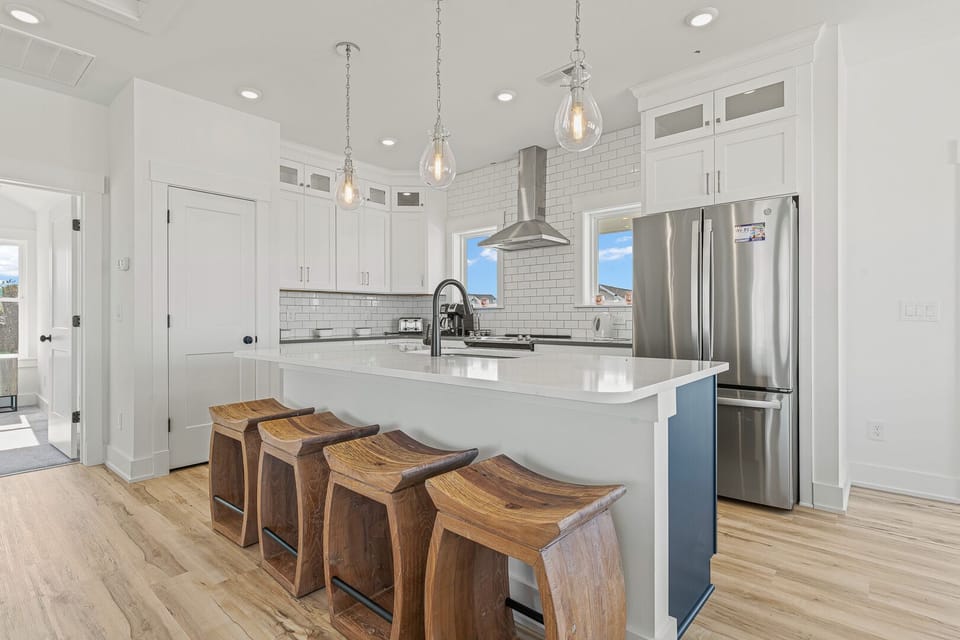 Kitchen with Bar Stool Seating on Third Level