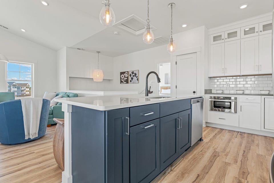 Kitchen with Bar Stool Seating on Third Level
