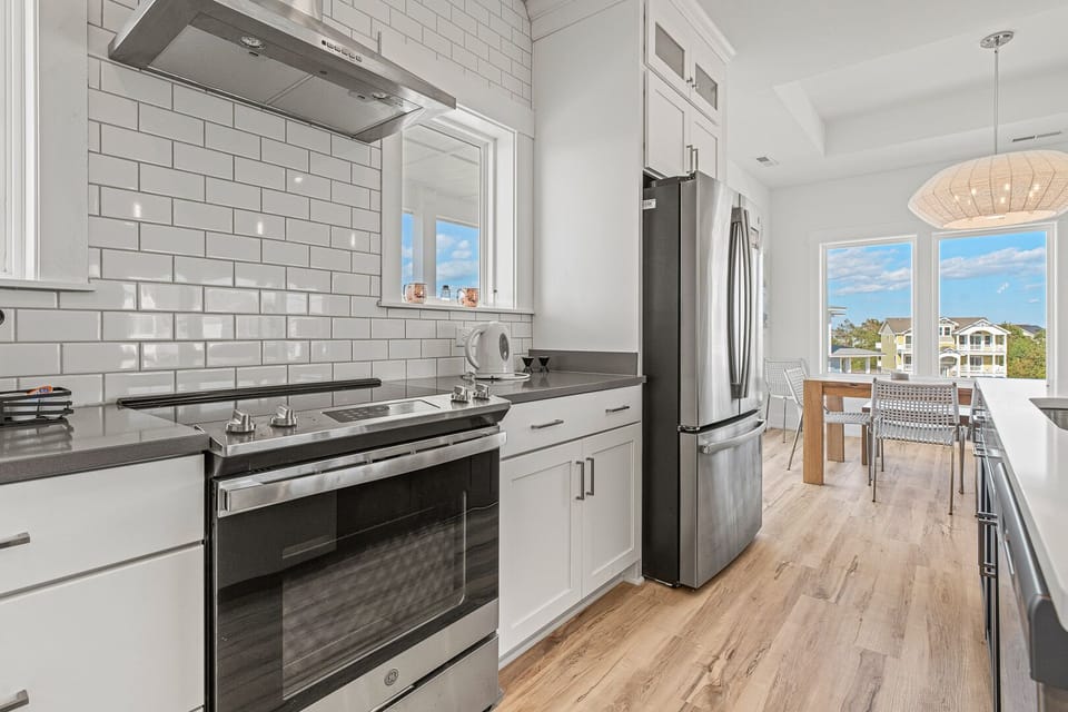 Kitchen with Bar Stool Seating on Third Level
