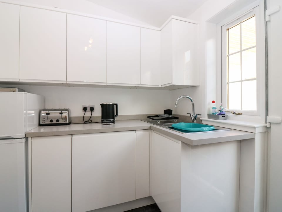Fridge, electric kettle, toaster, cookware/dishes/utensils