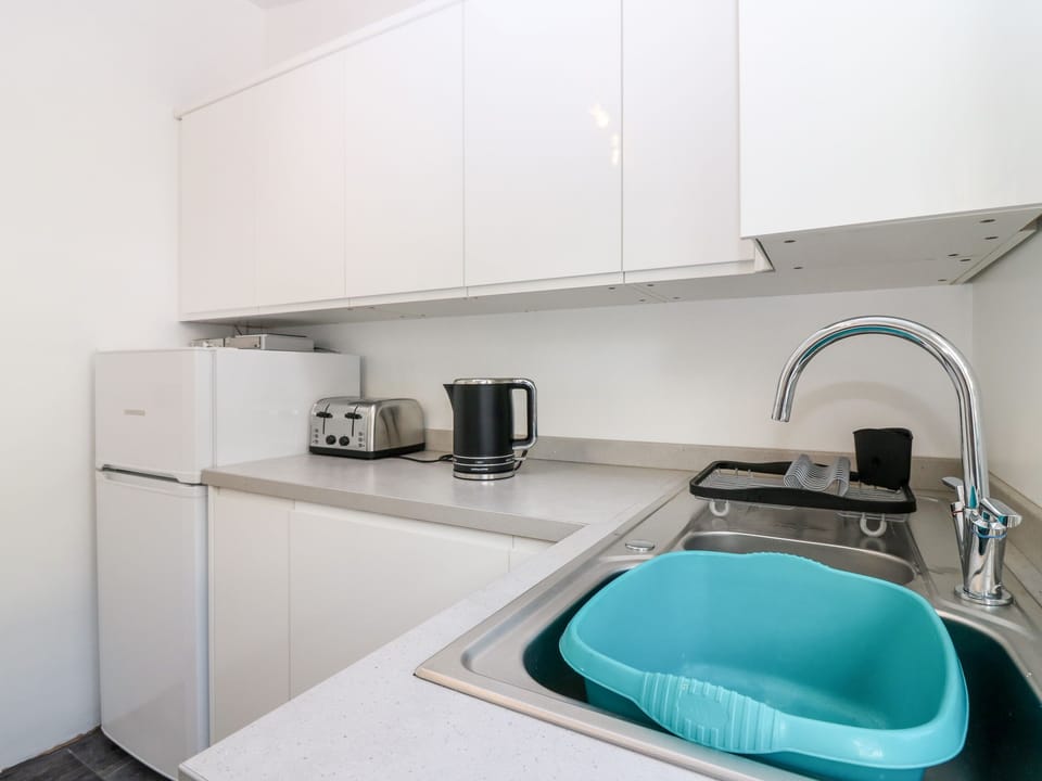 Fridge, electric kettle, toaster, cookware/dishes/utensils