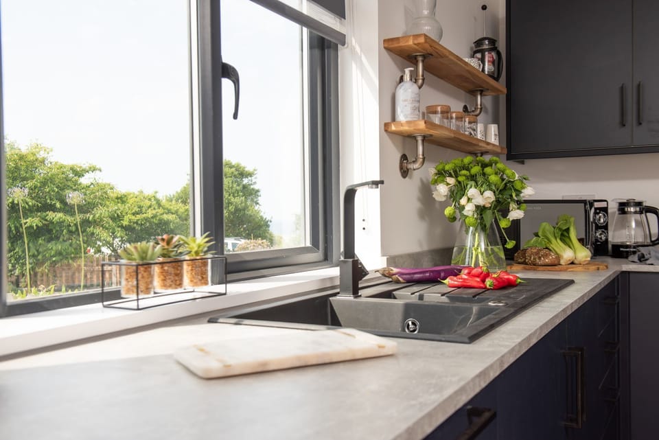 Bright and airy kitchen with large window - Bay Dream