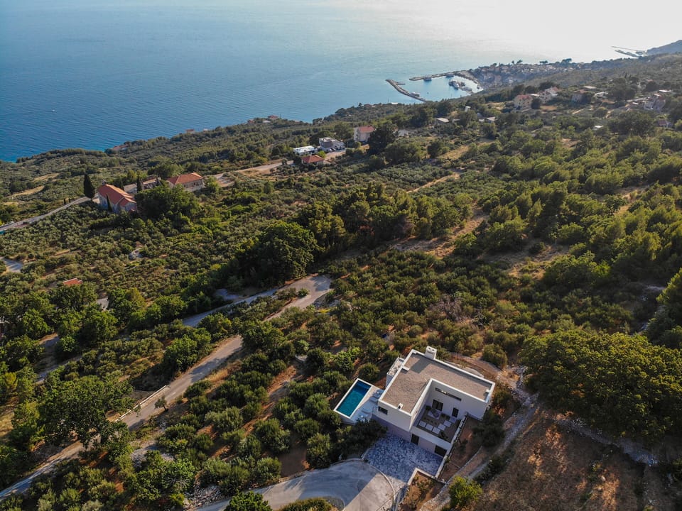 Aerial photo of Villa Marmoris surrounded with olive fields. 