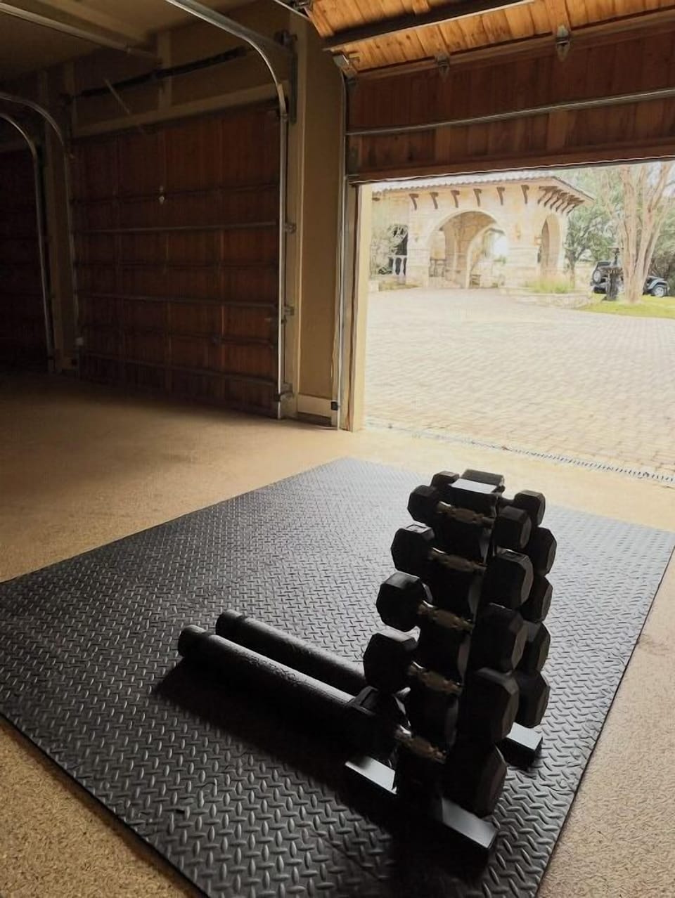 workout equipment in garage (yoga matts, weights)