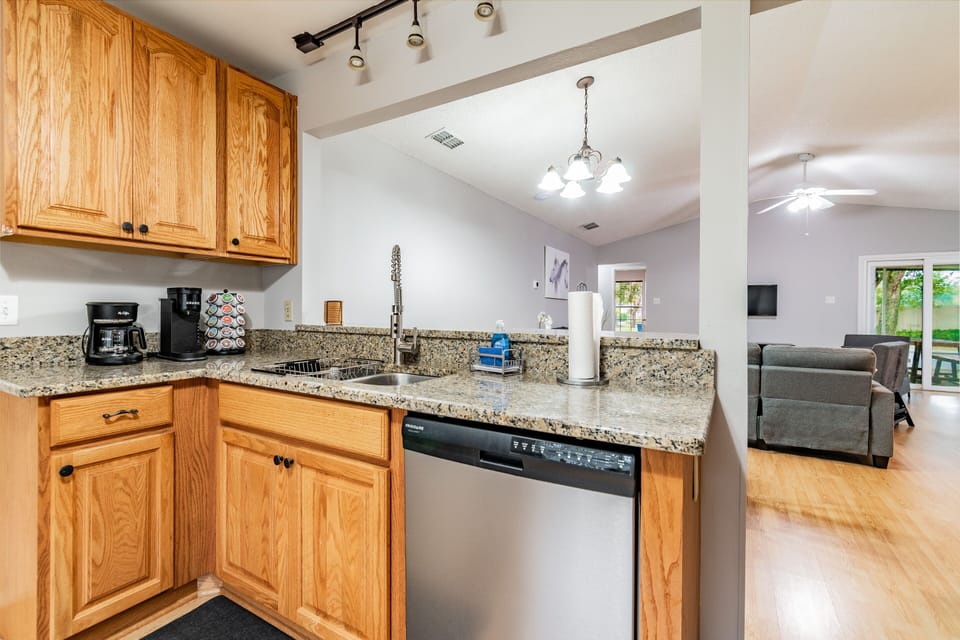 Kitchen Area overlooking Dining Room, Living Room and Back Porch