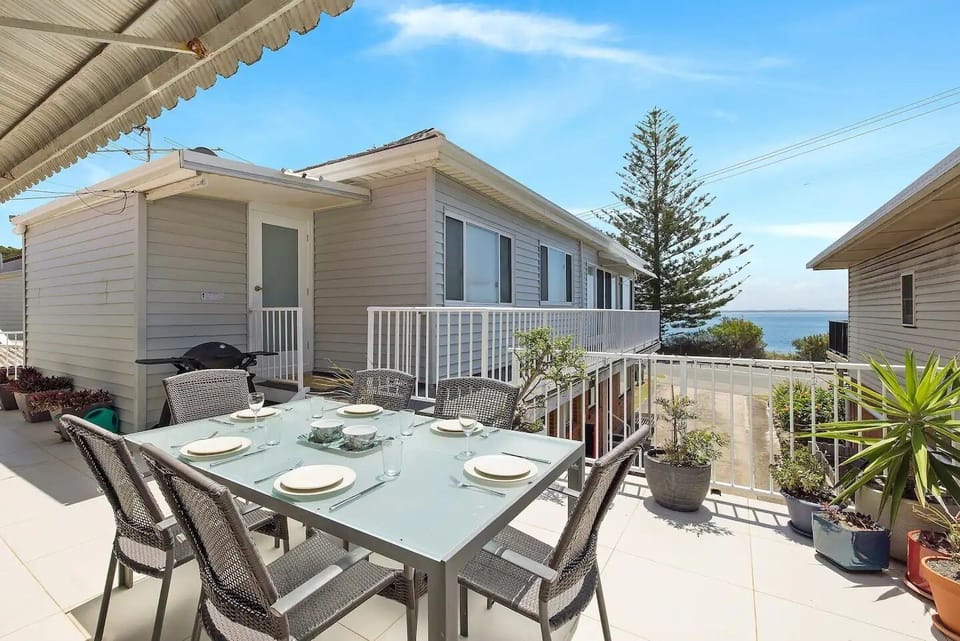 Outdoor balcony and furnishings with water view