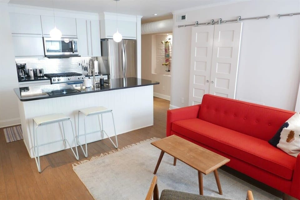 Kitchen island allows for a cozy dining space in the open floor plan living room 