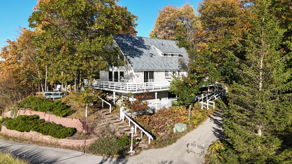 EXTERIOR:  The cottage sits up on the bluff overlooking Lake Michigan