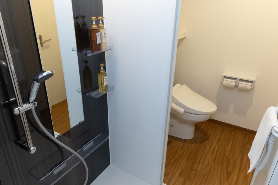 Comfort Twin Room, Multiple Beds, Non Smoking, Refrigerator & Microwave | Bathroom | Combined shower/tub, free toiletries, hair dryer, slippers
