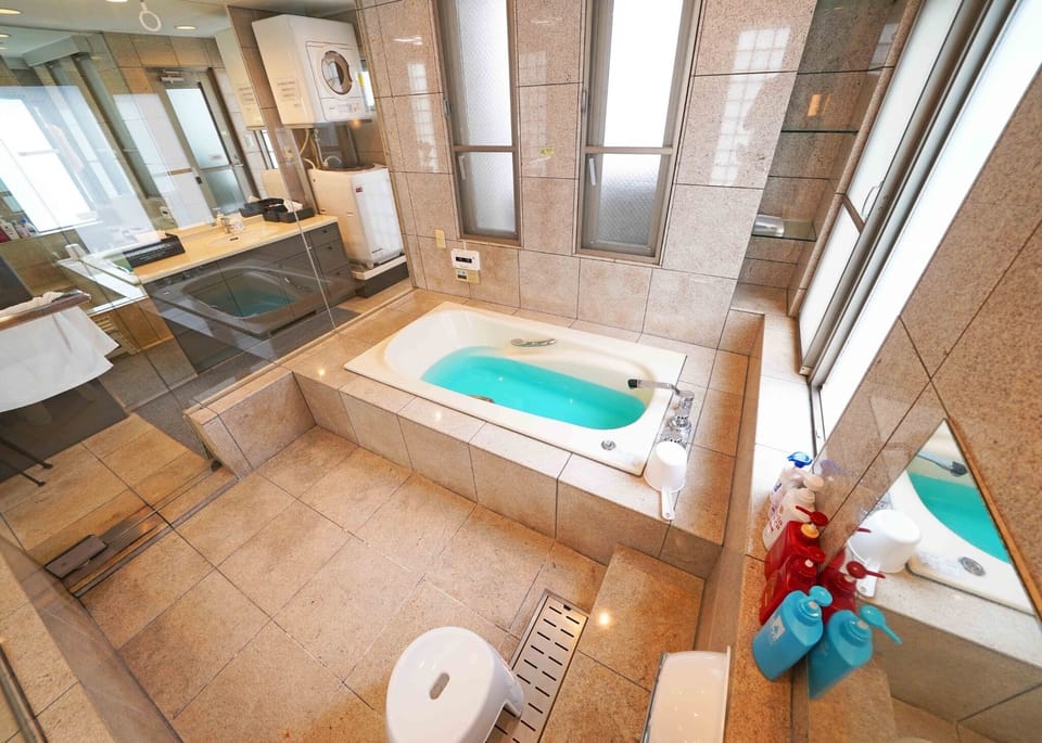 Relax in the open, glass-enclosed bathroom