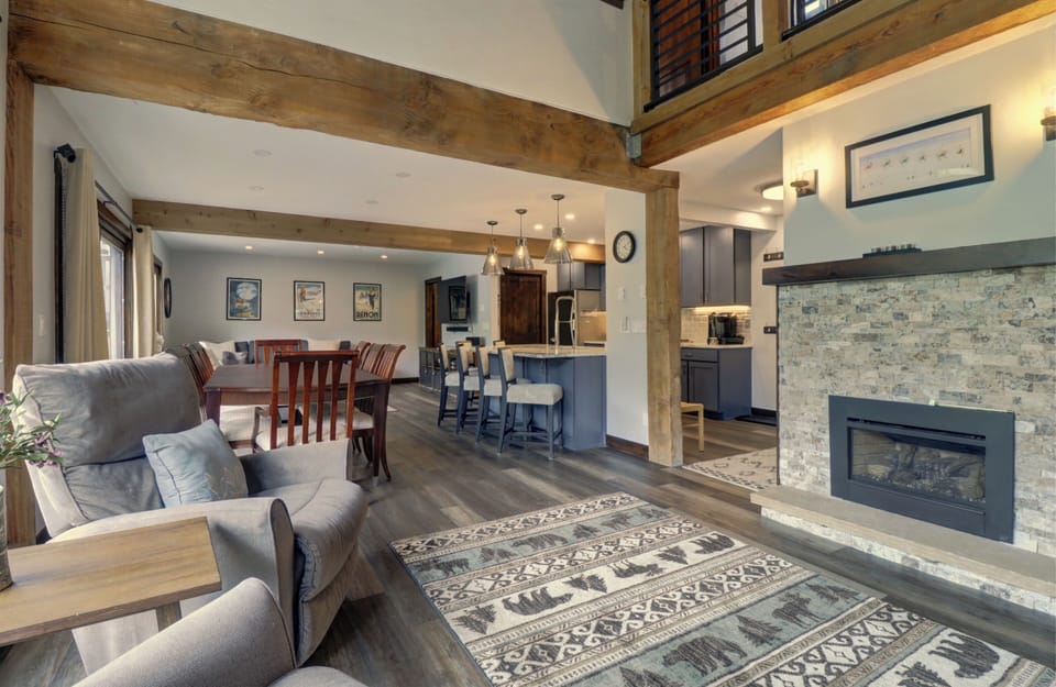 Living room features a cozy fireplace area