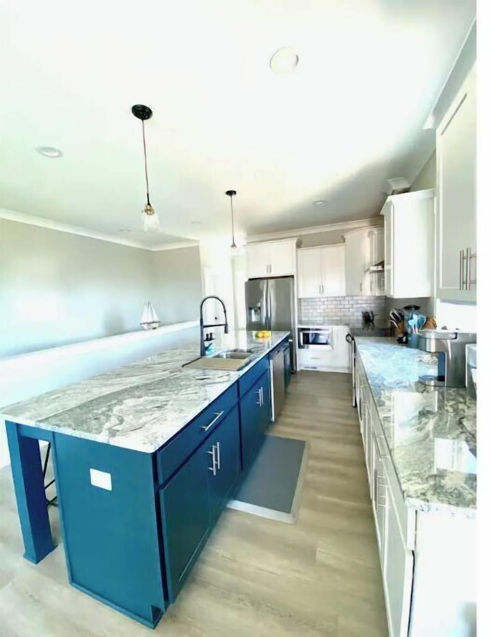 Beautiful granite countertops and goose-neck sink faucet
