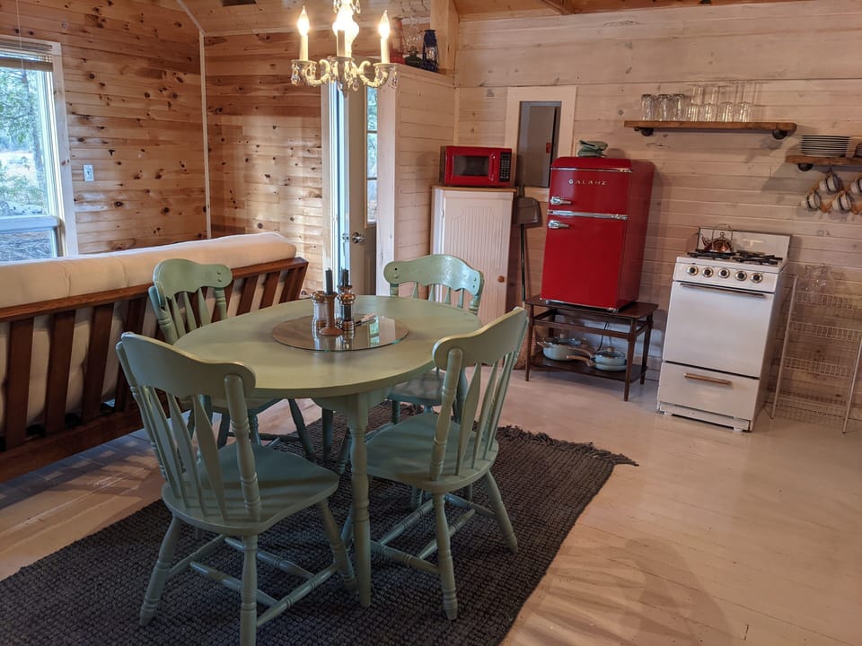 Kitchen table, small stove, microwave, small fridge, also large cooler provided.