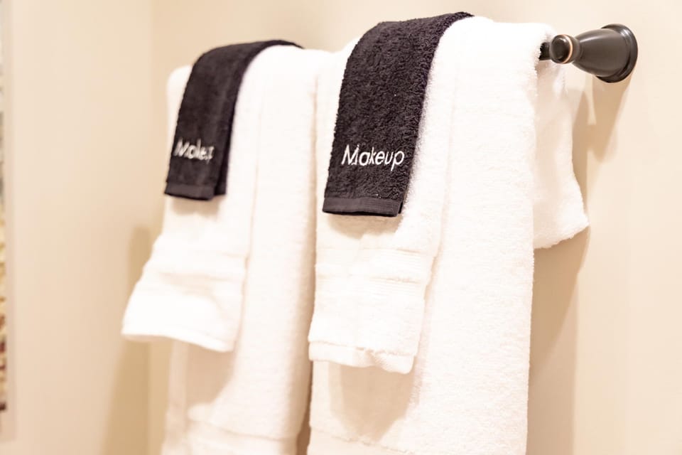 Soft white towels and black for washing off make-up.