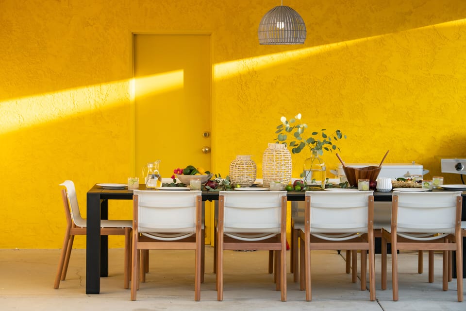 PIcturesque outdoor dining area with a huge table.
