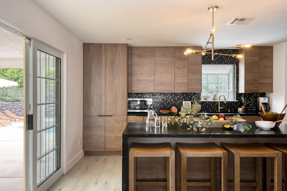 Modern kitchen with barstool seating at the island.