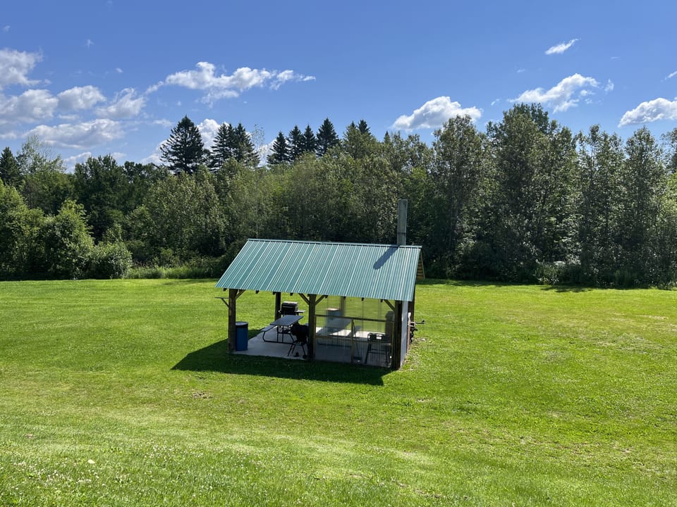 Beautiful front yard with communal pavilion with grills and fireplace!