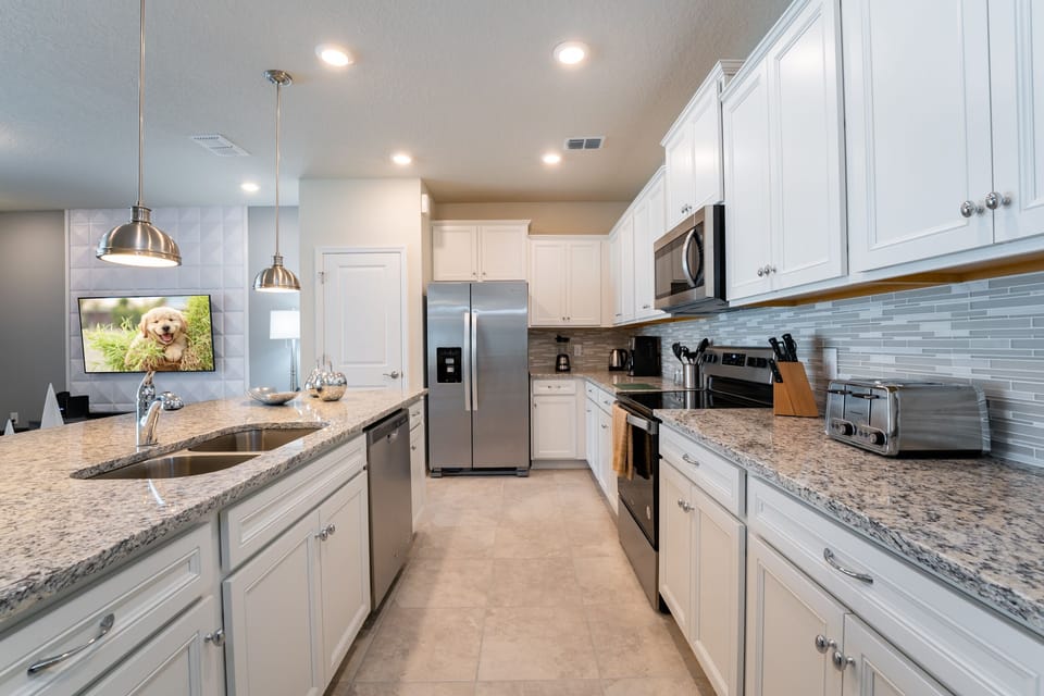Galley Style Kitchen with stainless appliances