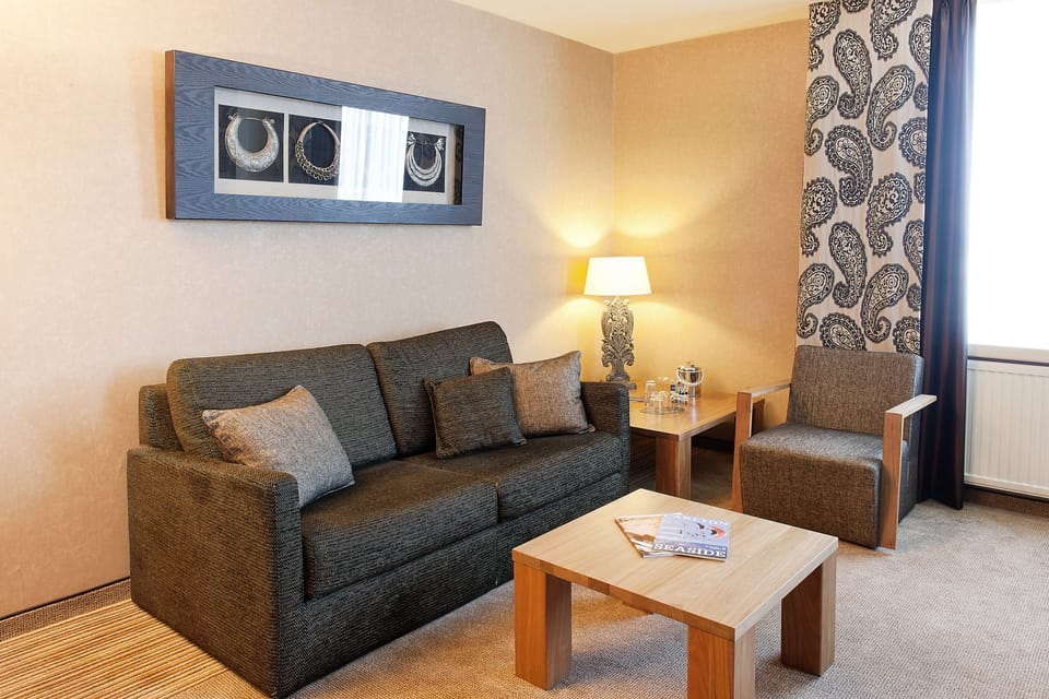 Family Suite, 1 King Bed with Sofa bed | Living area | 32-inch LCD TV with digital channels, TV, foosball