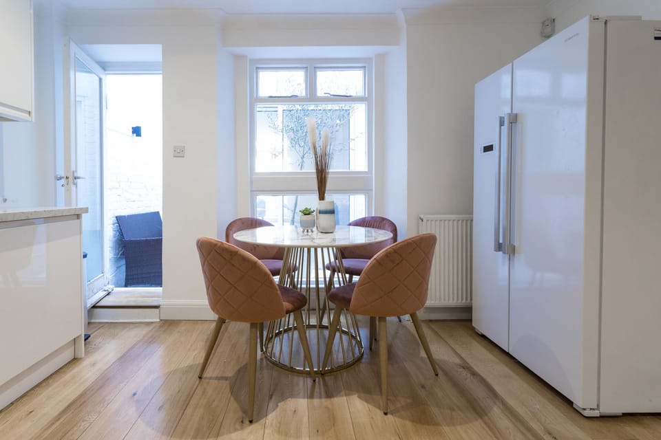 Eat in kitchen with large fridge freezer