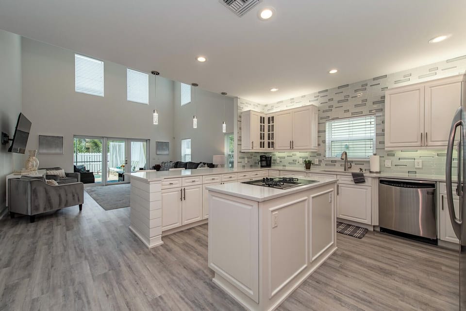 A bright, equipped kitchen with ample counter space and modern appliances — ideal for morning coffee, vacation meals, and happy-hour snacks