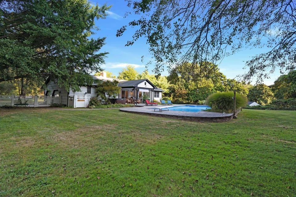 Poolside lawn with space to relax and play