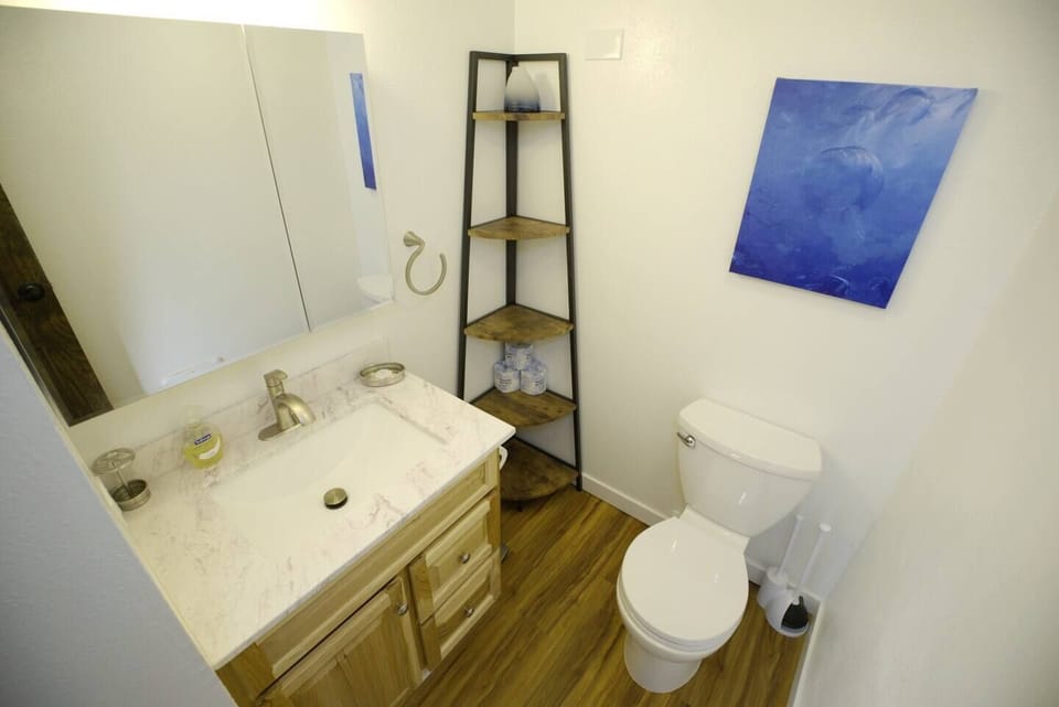The powder room is on the main floor, near the entrance.