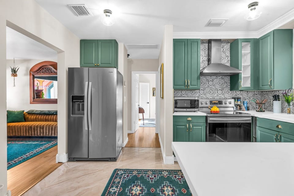 Kitchen, fridge and bedroom/bathroom hallway