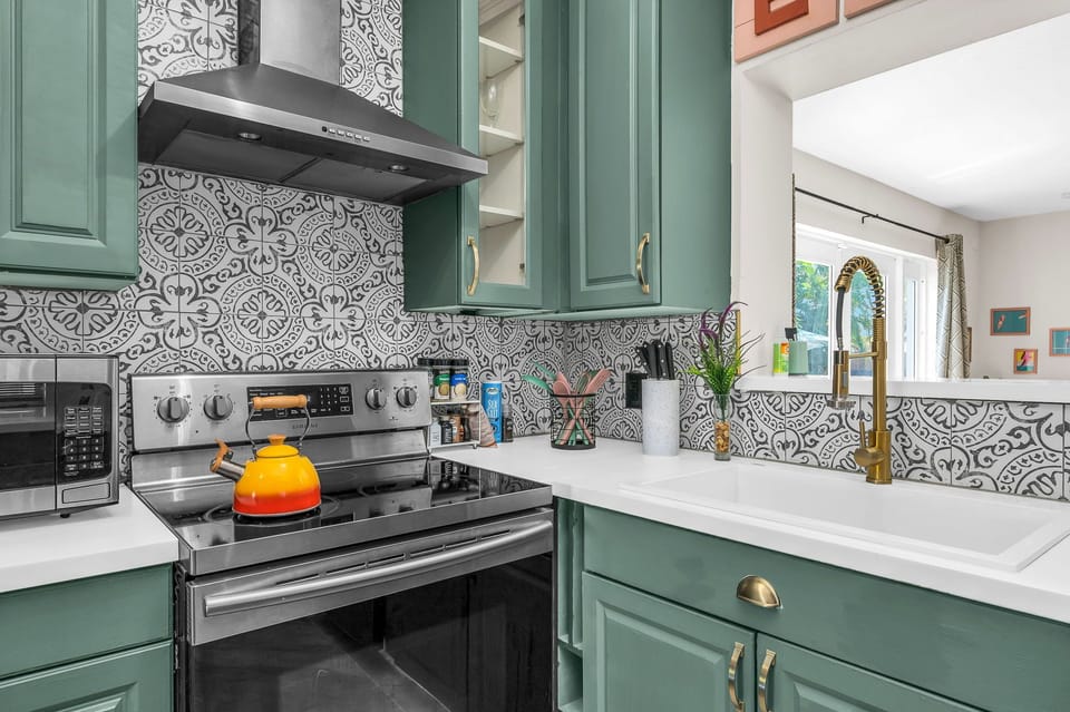Kitchen area with tiled backsplash