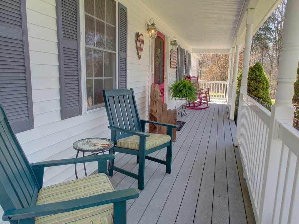 Peaceful covered porch for enjoying your coffee or wine!