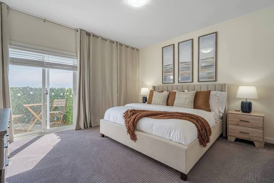 One of the two primary bedrooms. Each offers a king sized bed, 58' smart TV, en suite bathroom and more. 